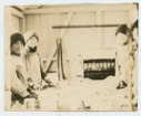 Image of Eskimo [Kalaallit] girls packing halibut